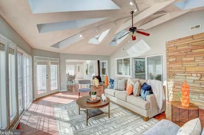 Bright common area with natural light and cozy furniture