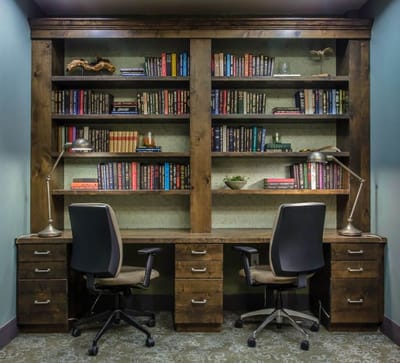 Interior view of a cozy reading nook with bookshelves