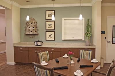 Dining room setup with tables and food service area