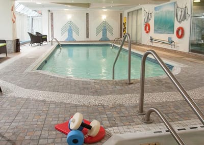 Indoor swimming pool area with decorative accents