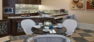 Modern dining area with food setup and tea service