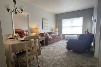 Bright interior common area with furniture and decor