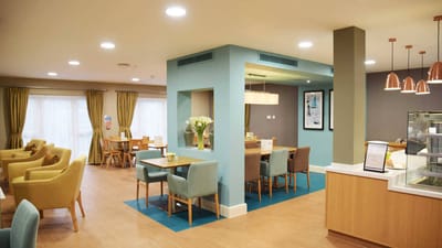 Bright and inviting common area with seating and decor