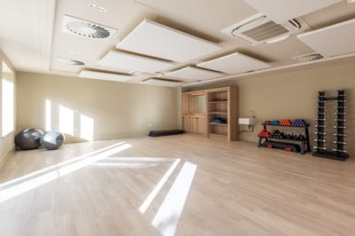Bright and spacious fitness room with equipment