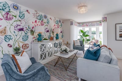 Brightly decorated lounge area with floral wallpaper