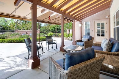 Outdoor seating area with comfortable chairs and tables