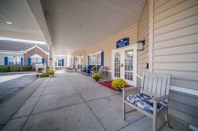 Welcoming entrance with seating and flowers