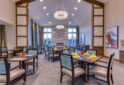 Bright dining room with tables set for a meal