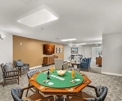 Common area with a card table and seating
