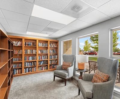 Bright interior library space with bookshelves and seating