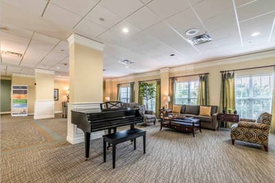 Common area with piano and seating arrangements