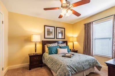 Cozy resident room with a bed and lamps