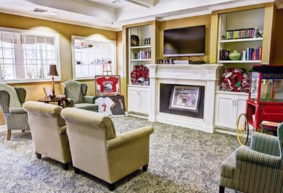 Cozy common area with seating and bookshelves