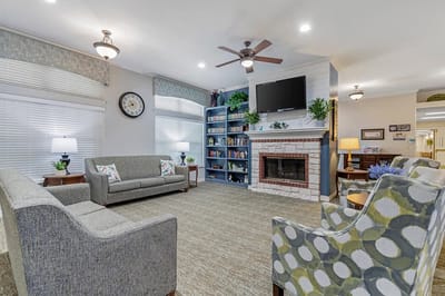 Comfortable common area with seating and bookshelves