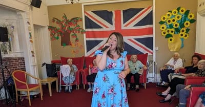 Residents enjoying a performance in a common area