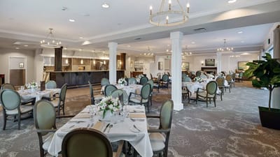 Elegant dining area with tables set for a meal