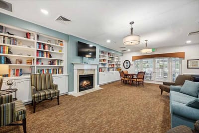 Cozy common area with bookshelves and seating