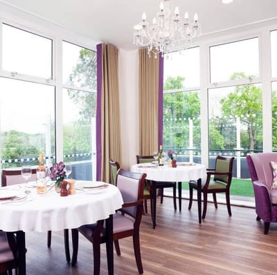 Elegant dining room with natural light and stylish decor