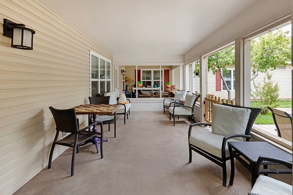Covered outdoor seating area with chairs