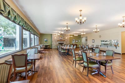 Interior view of the dining room with tables set