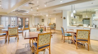 Bright common area with tables and chairs