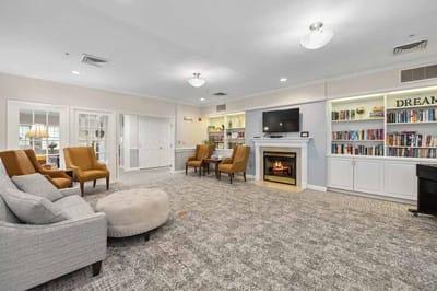Cozy common area with seating and bookshelves