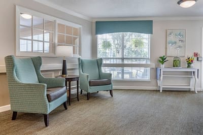 Cozy lounge area with armchairs and natural light