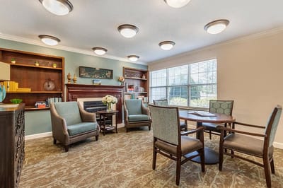 Interior common area with seating and bookshelves