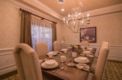 Elegant dining room setting with table set for a meal