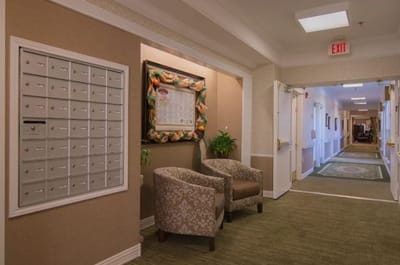Interior hallway with seating and mailboxes