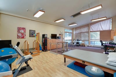 Physical therapy room with gym equipment
