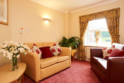 Cozy lounge area with comfortable seating and natural light