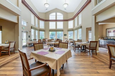 Bright dining area with tables and chairs