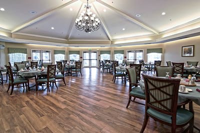 Bright dining room with tables set for meals
