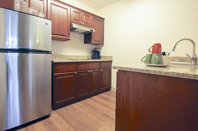 Bright kitchen area with modern appliances and decor