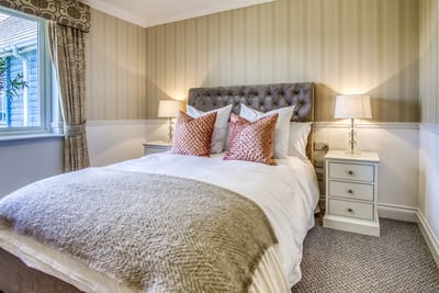 Cozy, well-decorated bedroom in an assisted living facility