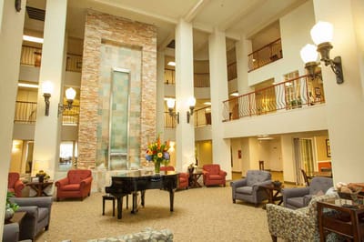 Interior view of a common area with piano and seating