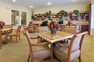 Bright common area with bookshelves and seating