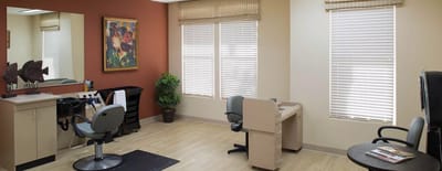 Bright interior beauty salon with chairs and mirrors