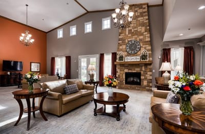 Bright common area with seating and decorative flowers