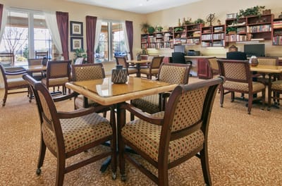 Interior common area with seating and bookshelves