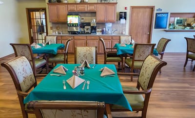 Dining area with tables set for a meal