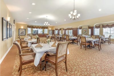Elegant dining room setup with tables and chairs