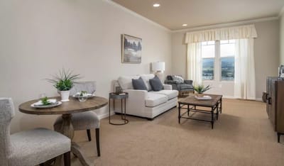 Cozy living room in a resident suite with natural light