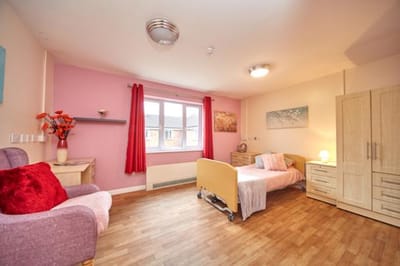 A well-furnished private resident room with natural light