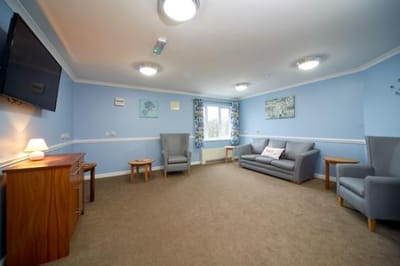 A bright lounge area with seating and decor