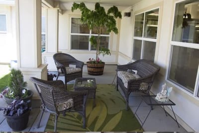 Outdoor seating area with potted plants.