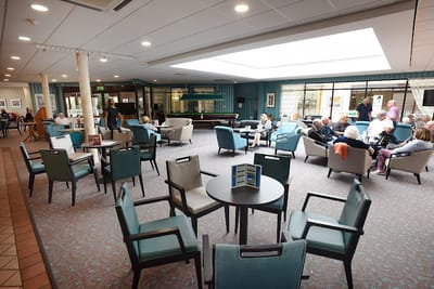 Residents socializing in a common area of the facility
