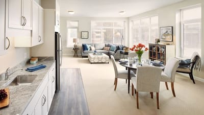 Bright interior of a resident's suite with dining area