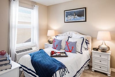Cozy bedroom with nautical decor and natural light